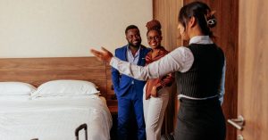 property manager showing guests their room creating great guest experience